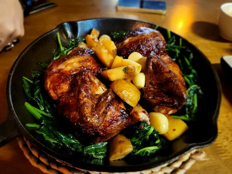Generous roast chicken image aligned with the menu and the relaxed bistro positioning