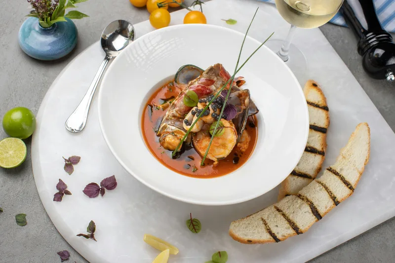Polished overhead seafood plate with strong Linen tones