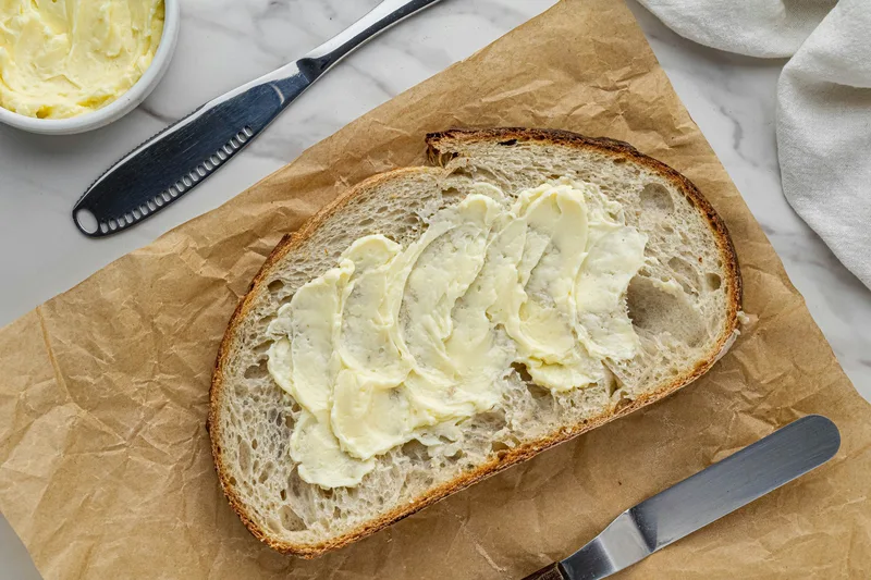 Clean bread-and-butter close detail with marble and pale linen